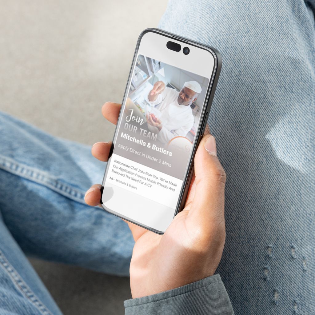 An example of a recruitment ad for Mitchells &amp; Butlers, shown on a phone. 