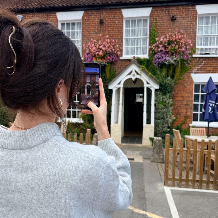 Taking portrait footage for social media content of a beautiful Wadworth pub exterior.