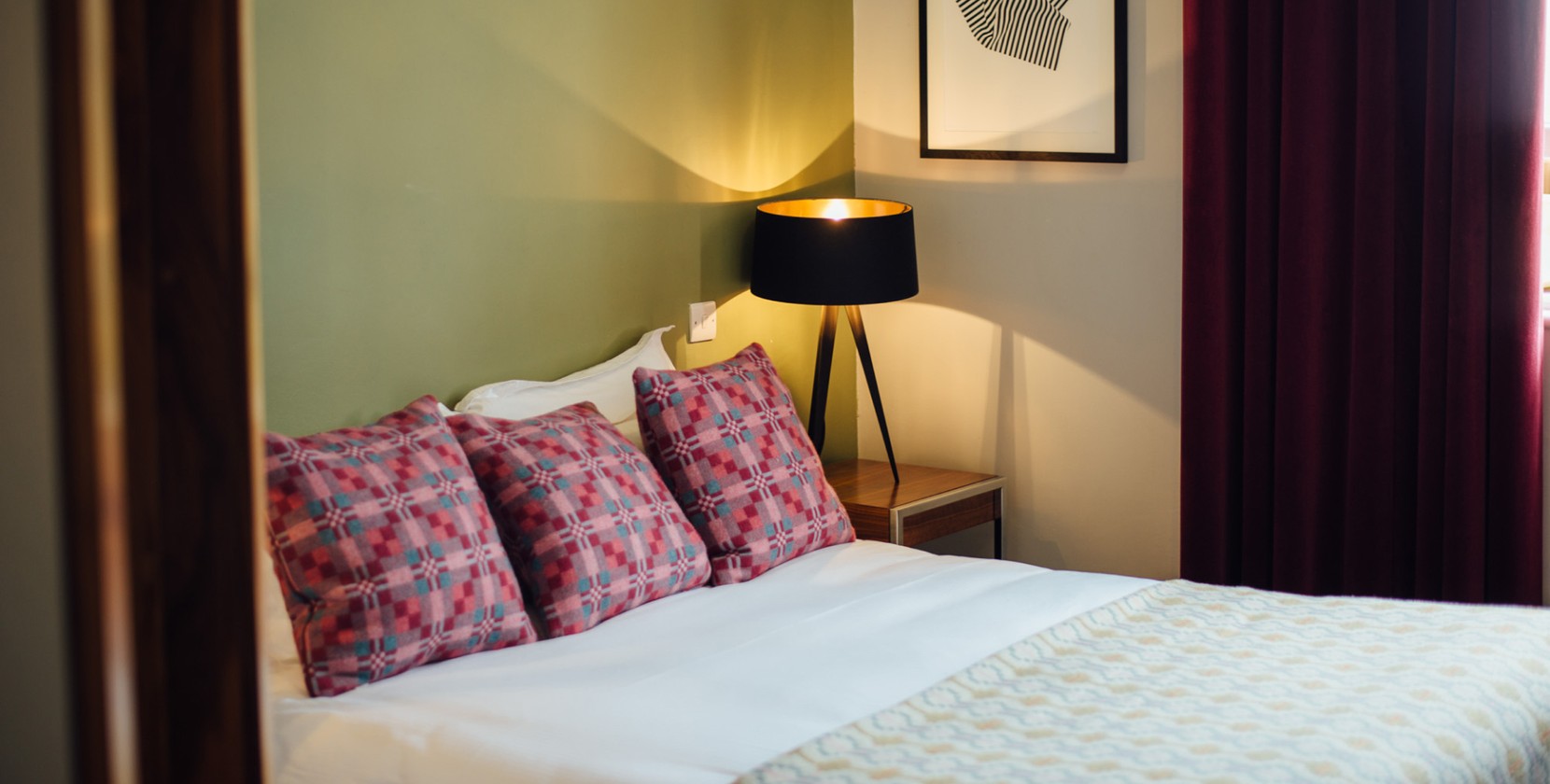 A calm, stylish hotel room at an Oakman Inns pub.