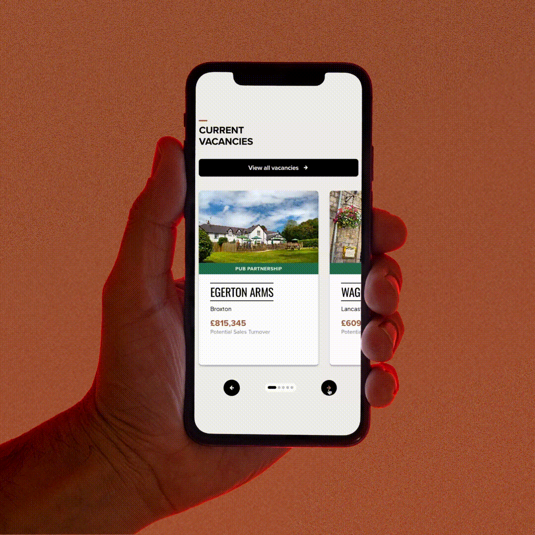A GIF of a hand holding a phone as the vacant pubs are swiped through on its screen.