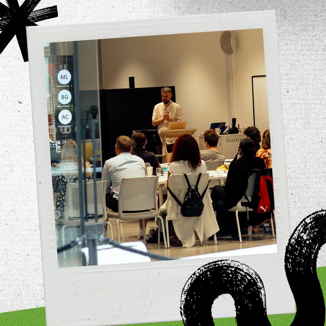 Brew team members listening to a presentation 