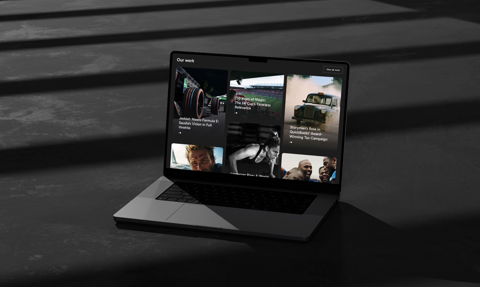 The Storyman website shown on a laptop screen. 