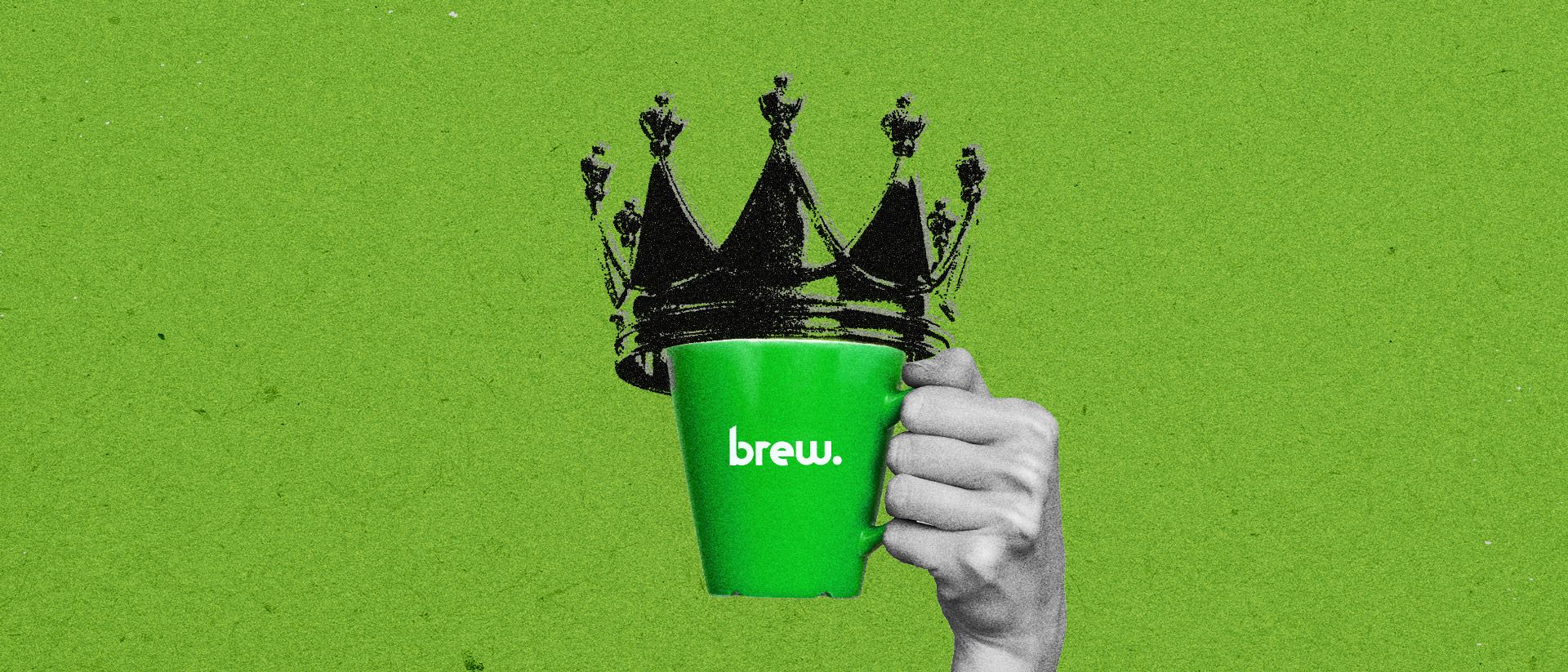 A hand holding a Brew mug with a crown on top. 
