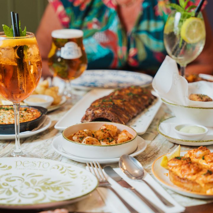 Close-up of a Pesto restaurant table showing various Italian dishes and drinks. One of the assets created for the restaurant social media content shoot.