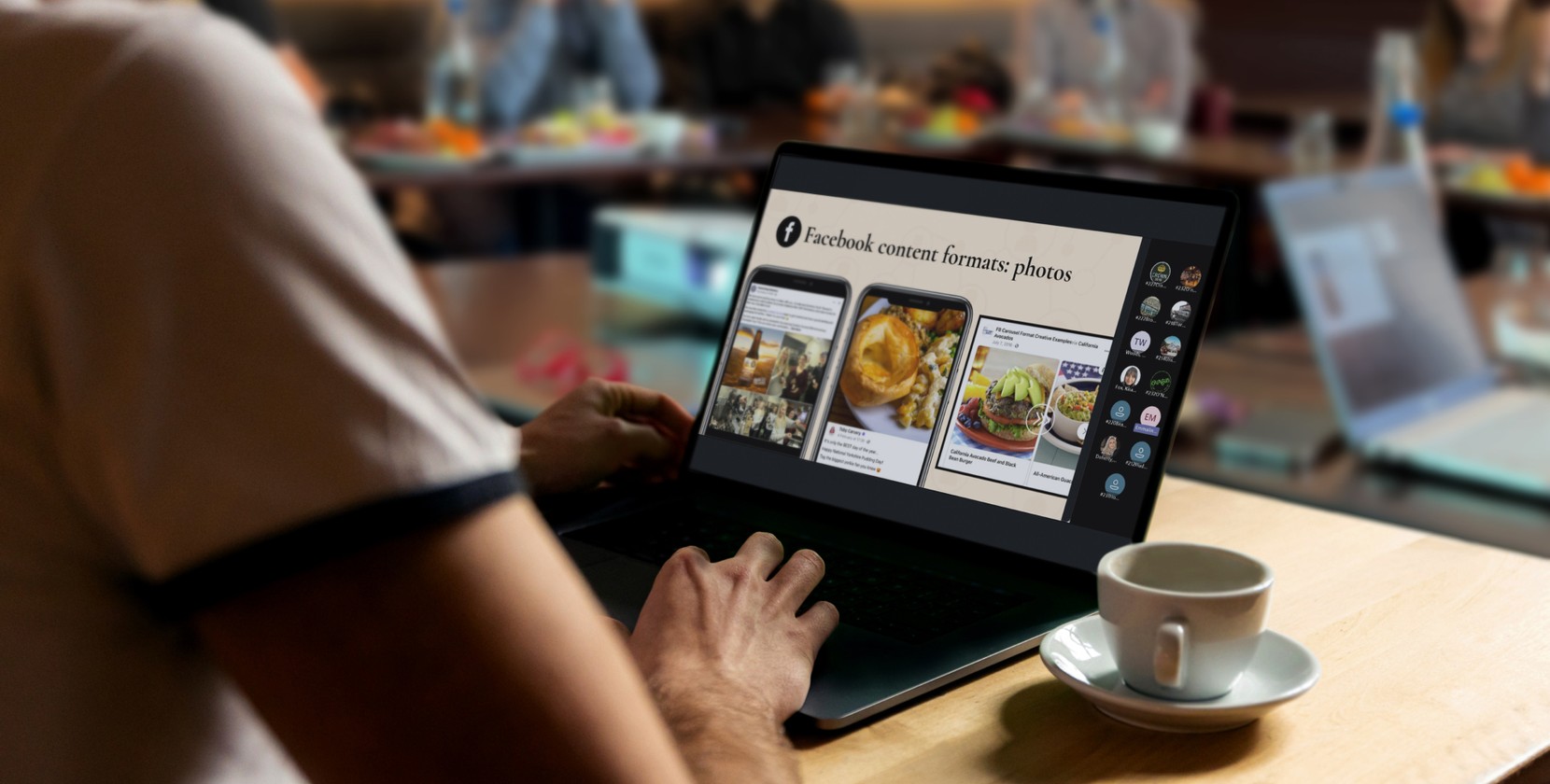 Someone in a cafe looking at Facebook photo formats on their laptop. 