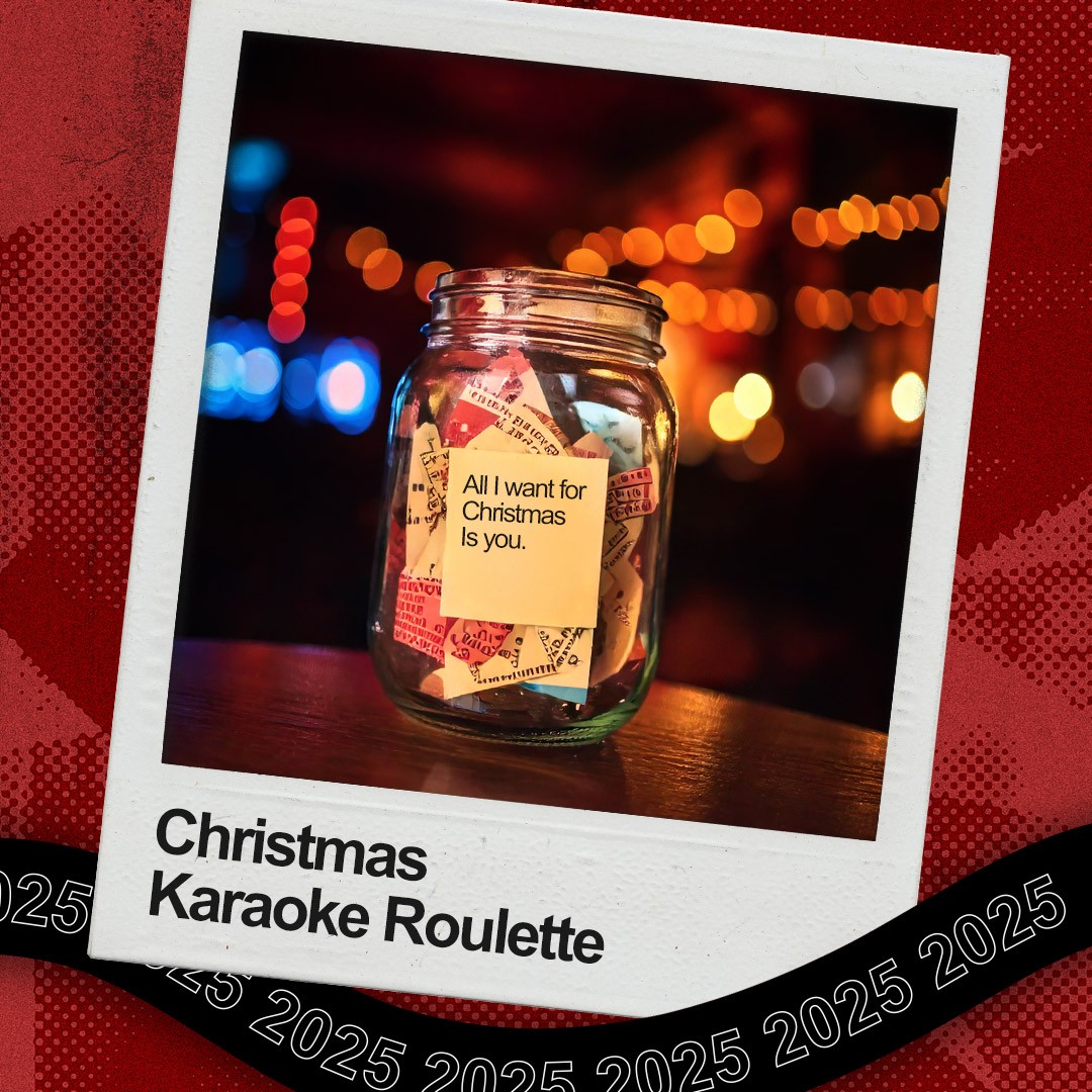 A photograph of “Christmas Karaoke Roulette,” with All I want for Christmas is you seen at the front of the jar. 