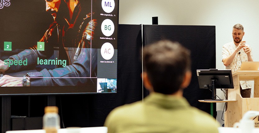 A photograph of Scott Barker, lead designer at Brew, speaking at the 2023 Brew Conference. 