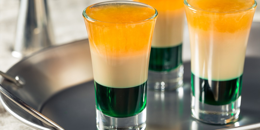 Multicoloured St Patrick’s Day shots, looking like the Irish flag with shades of green, white and orange. 