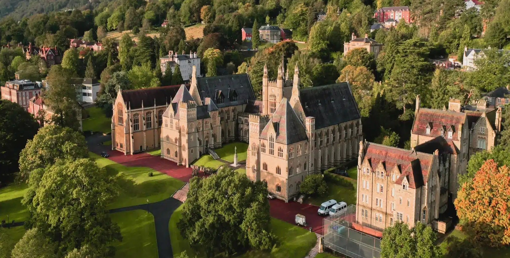 Overlooking the grand Malvern College, surrounded by lush trees.