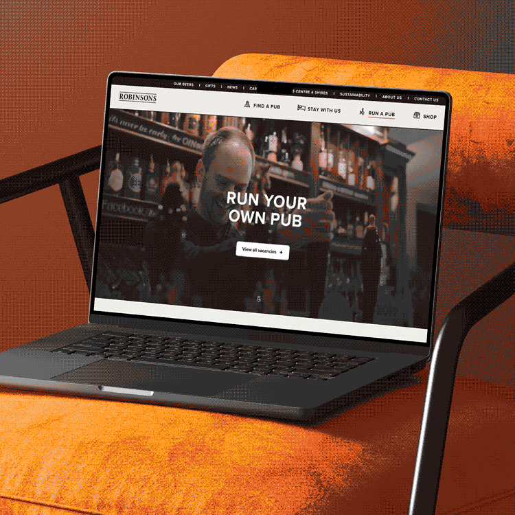 A GIF of the Robinsons website video banner in motion on a laptop.