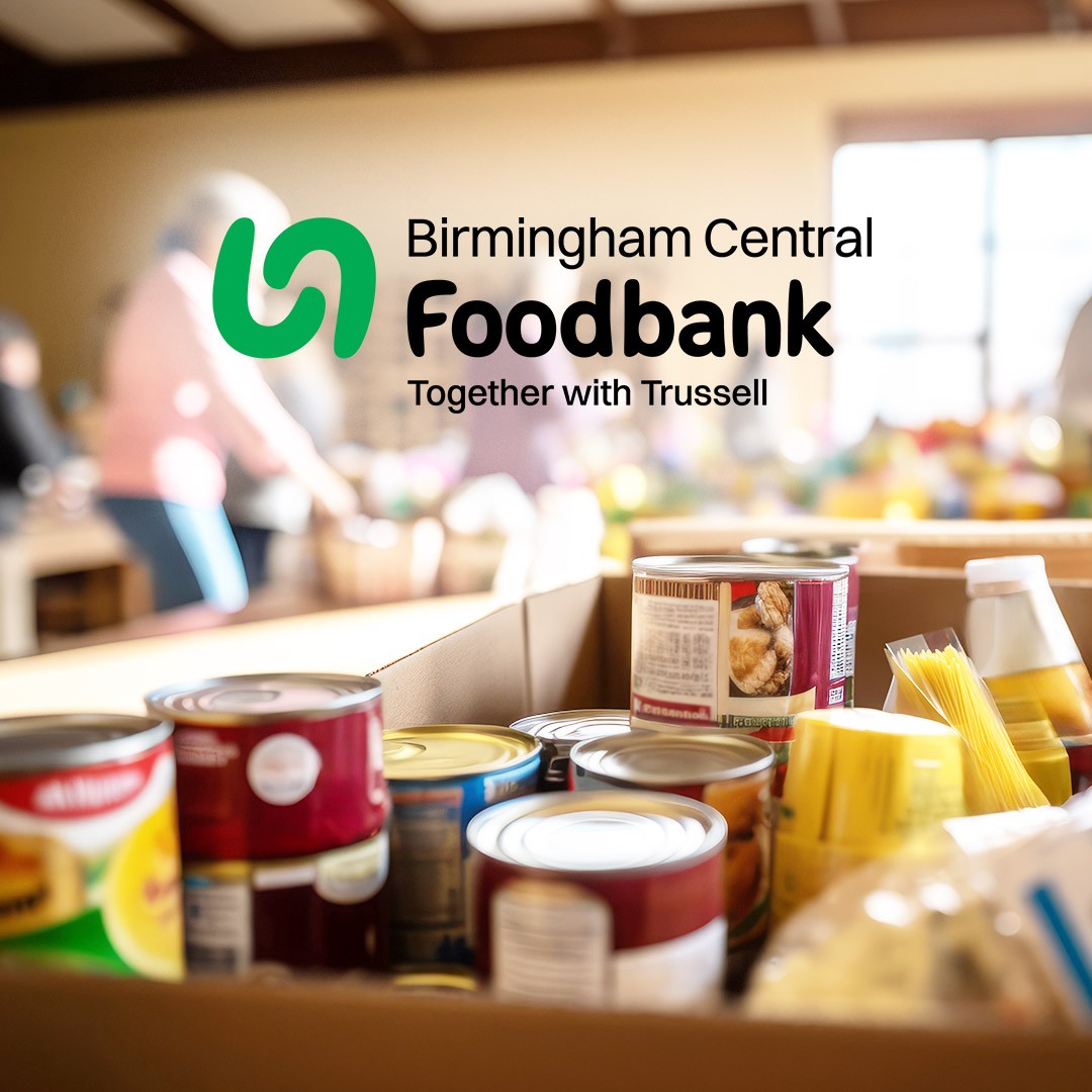 A photograph showing box of food bank collection items with the Birmingham Central Foodbank Logo overlaid.