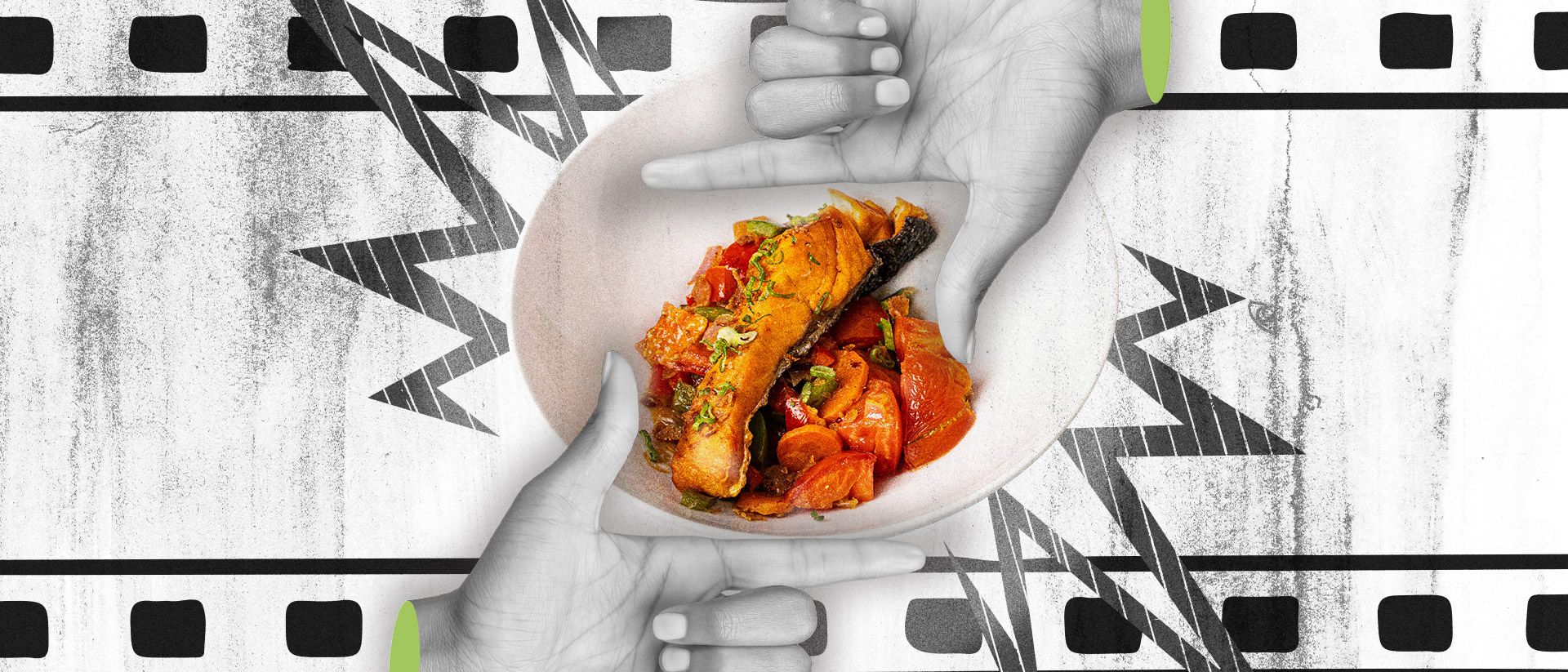 A grilled salmon salad highlighted by two hands.