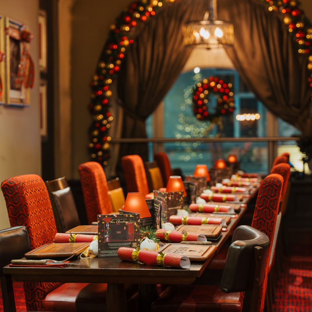 A luxurious festive dinner table awaits guest arrivals.