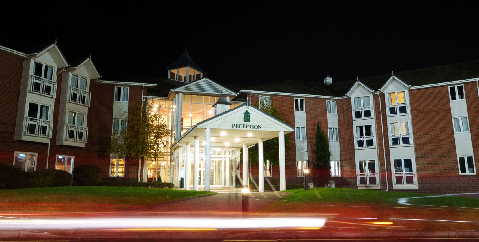 The welcoming, yet striking entrance to The Arden Hotel & Leisure Club at night.