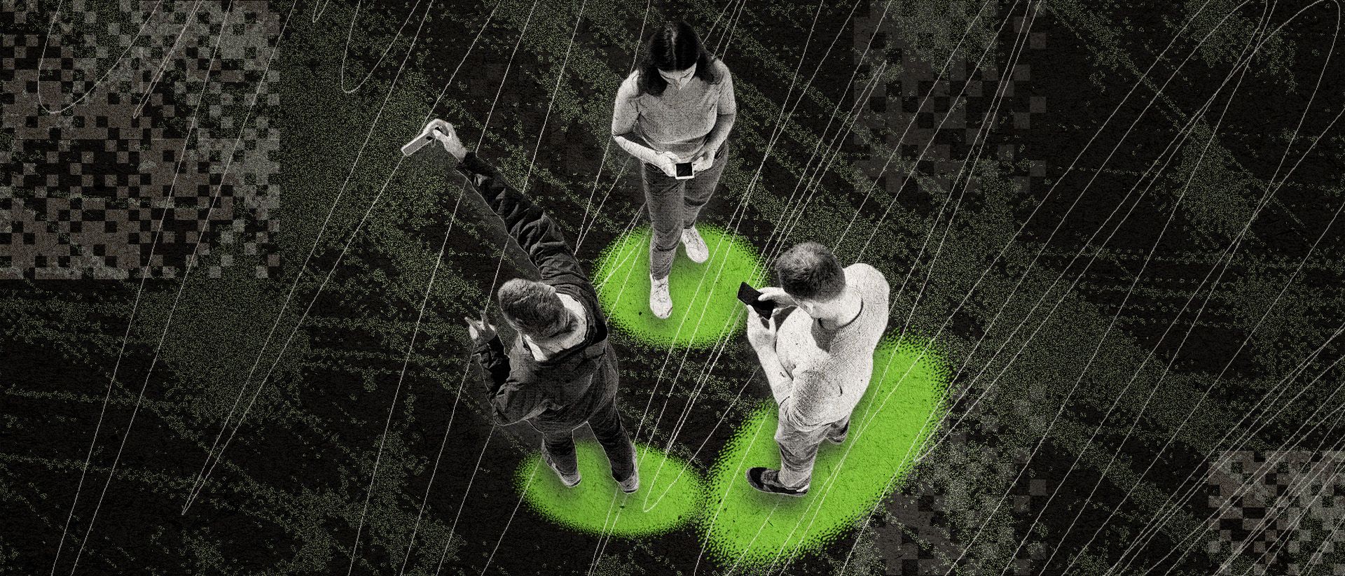 Three young adults standing together, looking down at their phones. 