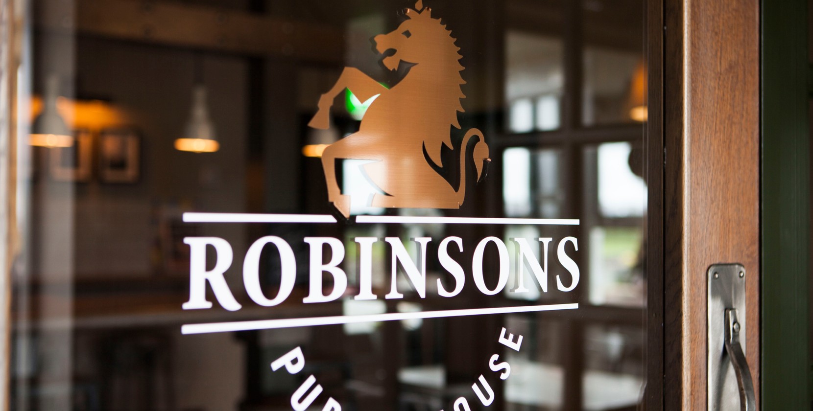 A window with the Robinsons logo on.